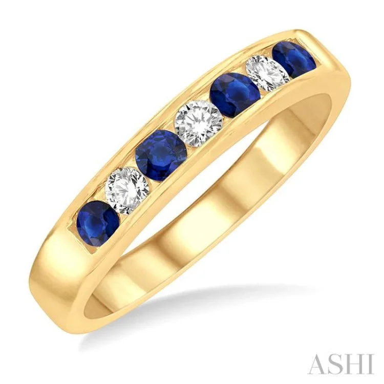 Handcrafted Wedding Ring Designs-1/5 Ctw Channel Set Round Cut Diamond and 2.5 MM Round Cut Sapphire Band in 14K Yellow Gold